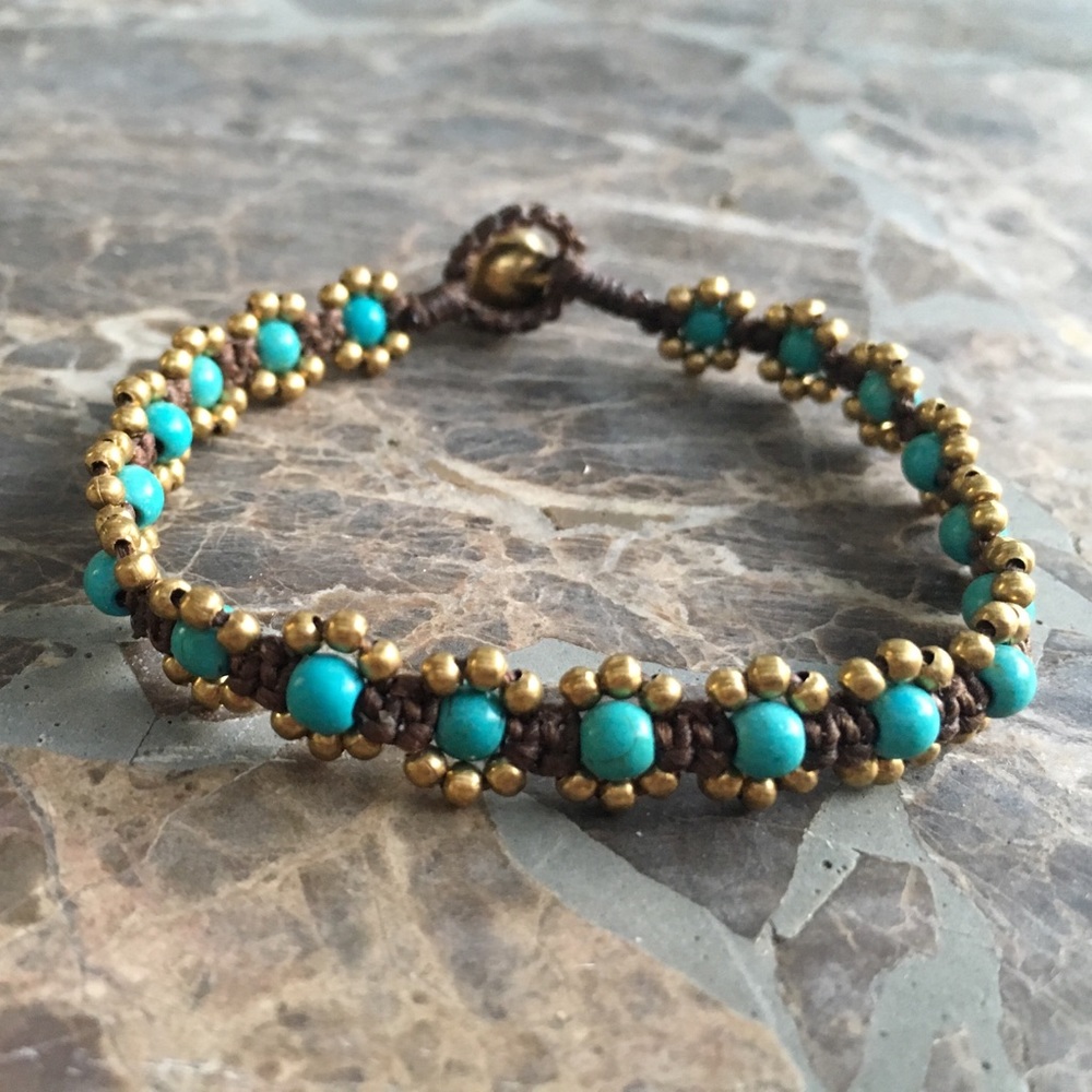 Hand woven beaded boho bracelet with brass bell